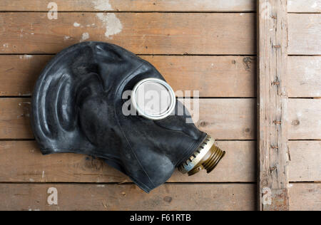 Closeup of old gas mask on wooden box Stock Photo