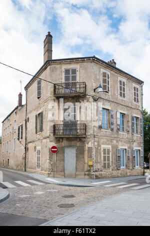 A French street scene in Chagny Burgundy France with an old building with shutters Stock Photo