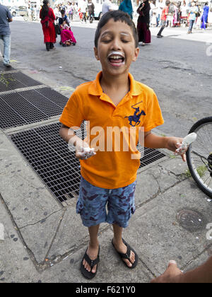 Bangladeshi boy at street fair in 'Little Bangladesh' in the Kensington section of Brooklyn, NY. Stock Photo