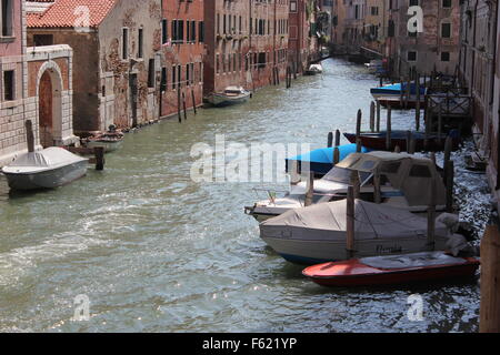 Boats moored in a side canal, Venice, Italy Stock Photo
