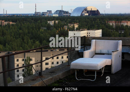 The abandoned town of Pripyat and the nearby Chernobyl Nuclear Power Plant seen from the roof of a high-rise building. Exclusion Zone, Ukraine. Stock Photo