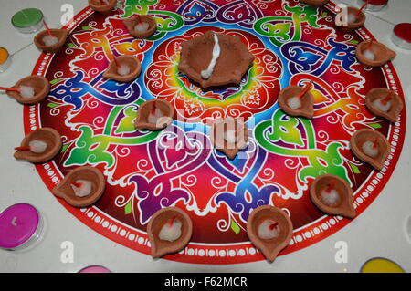 Multicolor rangoli with diya and diwali hindu festival in singapore Stock Photo