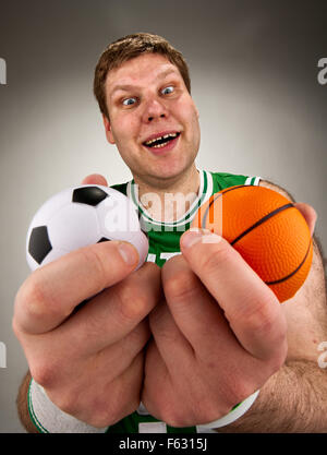 Portrait of surprised basketball player with two balls Stock Photo