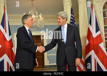 US Secretary of State John Kerry meets with UK Foreign Secretary Philip Hammond following their bilateral meeting at the Department of State November 9, 2015 in Washington, DC. Stock Photo
