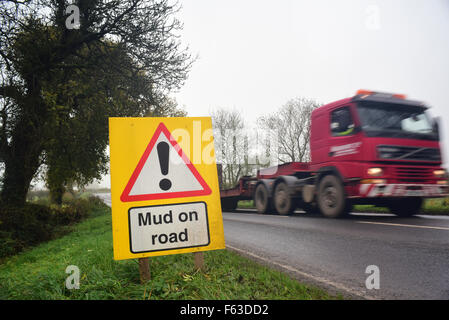 lorry passing mud on road ahead warning sign yorkshire united kingdom Stock Photo