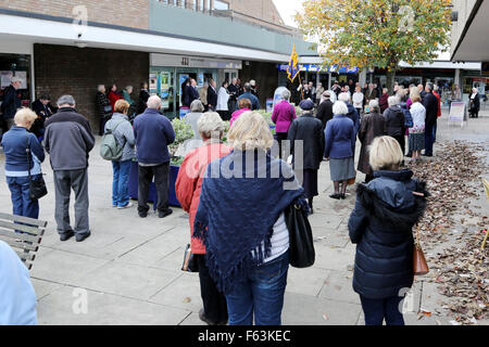 Portishead, Bristol, UK. 11th November, 2015. A two-minute silence was observed across the UK to remember the nation's war dead. Local people gathered in the Portishead town precinct and were joined by those out shopping to commemorate the dead of the two world wars at 11.00am. Credit:  Stephen Hyde/Alamy Live News Stock Photo