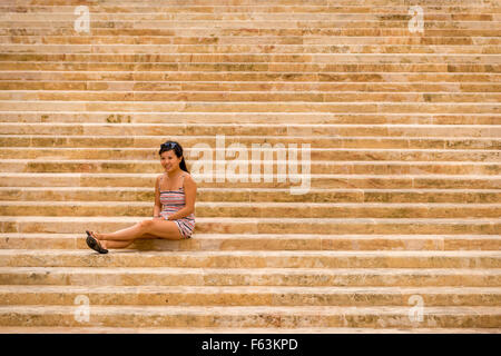 On steps near the main gate of the city of Valletta, Malta. Stock Photo