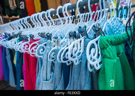 Clothes on hangers in a clothes shop Stock Photo