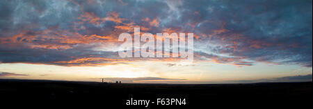 Sunset catching underneath of clouds Stock Photo