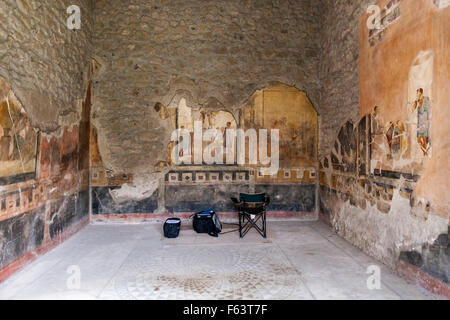 Fresco mural wall paintings at the Casa Degli Amorini Dorati, House of the Gilded Cupids, Pompeii are monitored and restored Stock Photo