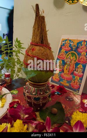 Diwali pooja with narial , God laxmi, ganesha, and water kalash Stock Photo