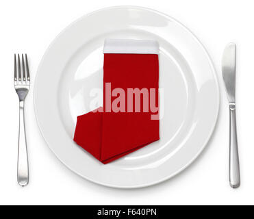 christmas dinner, table setting, napkin folded as a santa claus boots Stock Photo