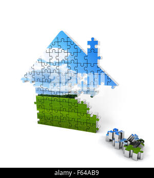 Blue and green house consisting of puzzles on white background Stock Photo