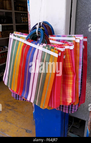 Colorful striped Mexican shopping bags for sale in a store Stock Photo