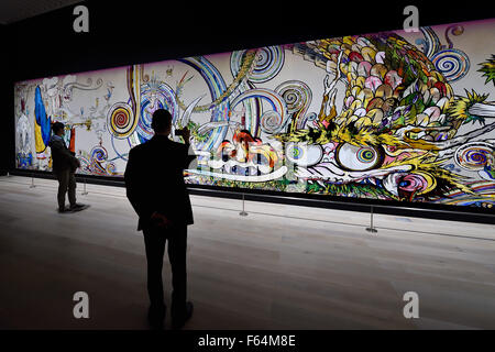 Tokyo, Japan. 11th Nov, 2015. Art patrons photograph the captivating art work of Japan's internationally acclaimed contemporary artist Takashi Murakami at the exhibition entitled Takashi Murakami: The 500 Arhats at the Mori Art Museum, Tokyo, Japan. Photography in the galleries of the exhibition Takashi Murakami: The 500 Arhats is permitted for private use and for sharing on social media websites. The exhibition at the Mori Art Museum runs from October 31, 2105 through March 6, 2016.© 2012 Takashi Murakami/Kaikai Kiki Co., Ltd. All Rights Reserved. © Rory Merry/ZUMA Wire/Alamy Live News Stock Photo