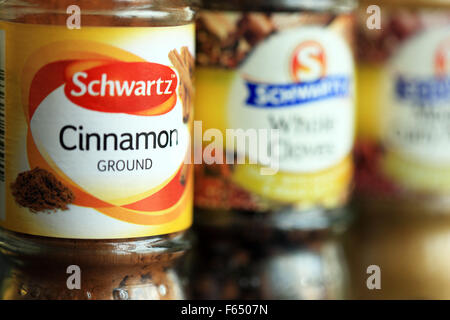 Cinnamon spice jar along with other Schwartz products, whole cloves Stock Photo