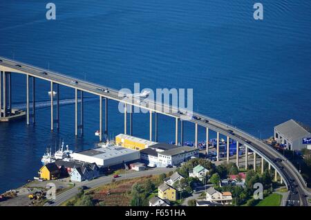 rush hour traffic over the bridge connecting the tromsoe city island to the mainland of tromsdalen Stock Photo