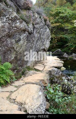 narrow rocky riverside  footpath Afon Glaslyn River Glaslyn Passsnowdonia Wales Cymru UK GB Stock Photo