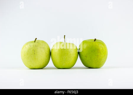 Three green apples, isolated on a white background Stock Photo