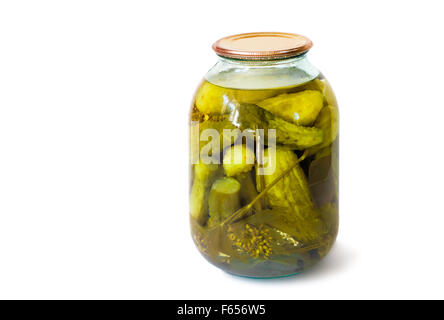 Home canning: a small glass cylinder with pickled cucumbers, sealed metal lid. Presented on a white background. Stock Photo