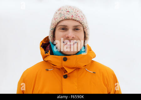 happy young man in winter clothes outdoors Stock Photo