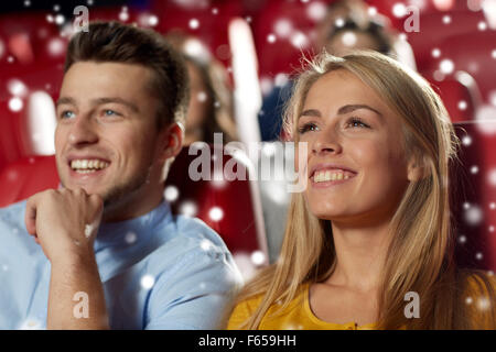 happy couple watching movie in theater Stock Photo