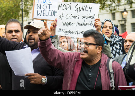 Whitehall, London, UK. November 12th 2015. Demonstrations take place outside the gates of Downing Street ahead of the arrival of India's Prime Minister Narendra Modi. Nepalese citizens protest against what they say is a blockade of their country by India whilst other groups opposed to Modi shout their anger, trying to drown out a smaller group welcoming the controversial leader to Britain. Credit:  Paul Davey/Alamy Live News Stock Photo
