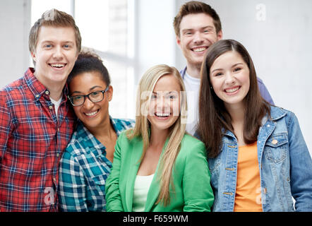 group of happy high school students or classmates Stock Photo