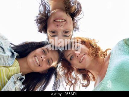 happy young women or teenage girls in circle Stock Photo