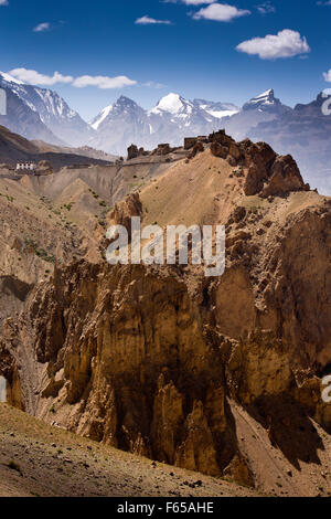 India, Himachal Pradesh, Spiti valley, Dhankar monastery on ridge and snow capped Himalayan peaks Stock Photo