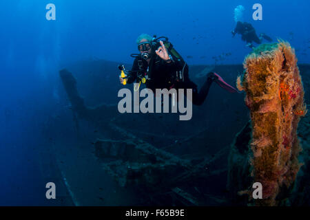 Diver at the MS Zenobia shipwreck. MS Zenobia was a Swedish built Challenger-class RO-RO ferry launched in 1979 that capsized an Stock Photo