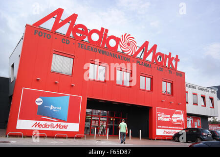 Striking red Media Markt store with logo on top in Germany Stock Photo