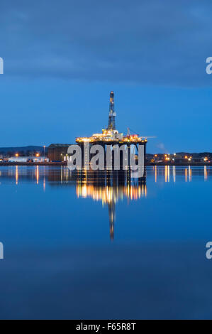Oil rig moored in the Cromarty Firth in Invergordon at dusk, Ross-shire, Scotland, UK. Stock Photo