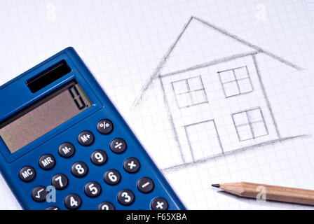 Calculator and pen lying next to the sketch of a house. Stock Photo