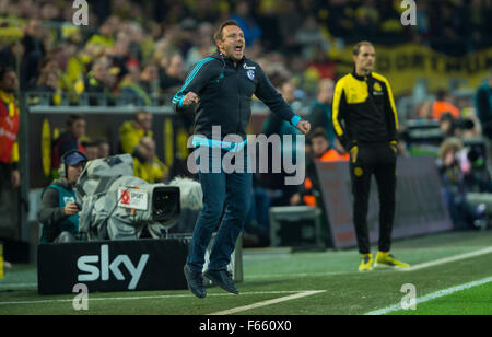 Dortmund, Germany. 08th Nov, 2015. Schalke coach Andre Breitenreiter gives instructions to his players while Dortmund coach Thomas Tuchel stands in the background, during the German Bundesliga soccer match between Borussia Dortmund and FC Schalke 04 at Signal-Iduna-Park in Dortmund, Germany, 08 November 2015. Photo: Guido Kirchner/dpa/Alamy Live News Stock Photo
