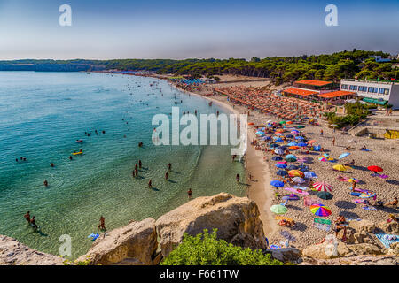 beach facilities on bay near rocky cove on the coast of Salento in ...