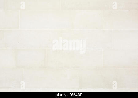 Beige tiled stone wall texture background Stock Photo