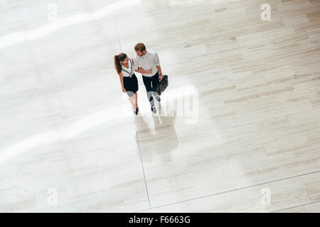 Business couple walking together. Top view Stock Photo