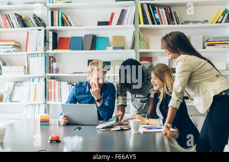 Brainstorming event between colleagues at work in office Stock Photo