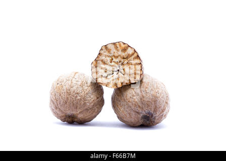 Nutmeg isolated on white background closely. Stock Photo