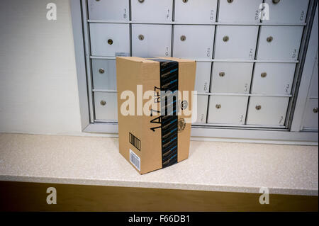 A package from Amazon Prime sits in front of an apartment building's mailboxes on Thursday, November 5, 2015. (© Richard B. Levine) Stock Photo