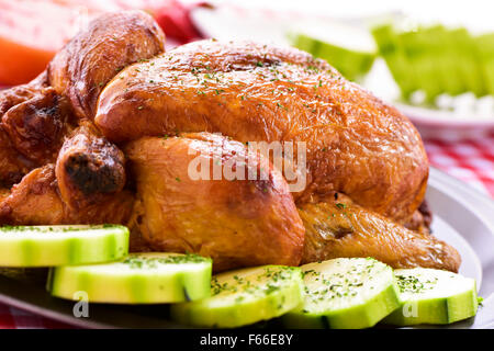 closeup of an appetizing roast turkey in a tray with vegetables Stock Photo