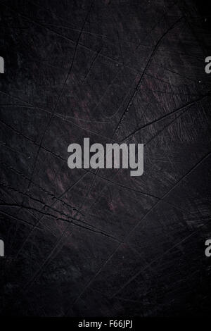 Rough textured scratched dark wooden background Stock Photo