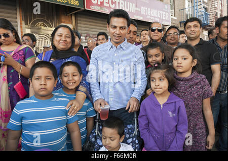 Bangladeshi families watch performance at street fair in the Kensington section of Brooklyn, New York, 2014. Stock Photo