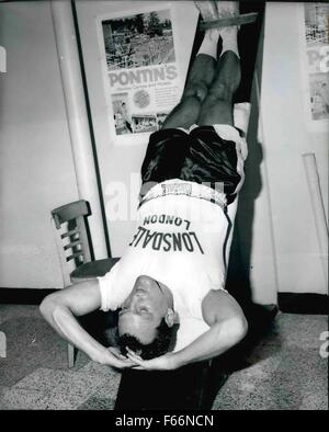 1966 - Boxer Brian London aka British Bulldog and Blackpool Rock. Confident he'll never be in this position in the ring. Brian London performs a variety of exercises during his training at the holiday camp. © Keystone Pictures USA/ZUMAPRESS.com/Alamy Live News Stock Photo