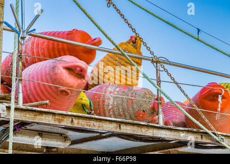 dirty floating buoys piled it on the boat Stock Photo