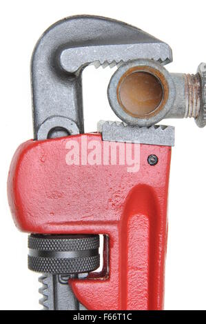 Pipe wrench plumbing fixtures on mesh filter grid Stock Photo - Alamy