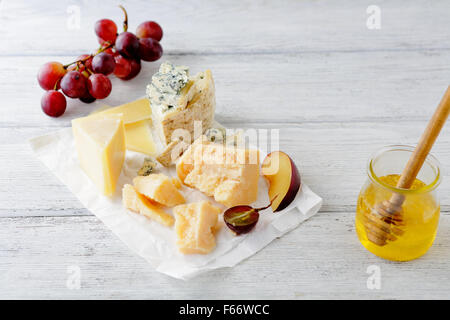delicatessen cheese on white table, food closeup Stock Photo