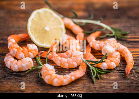 Seafood concept with shrimps on wooden background Stock Photo