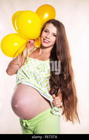 Pregnant woman with balloons Stock Photo